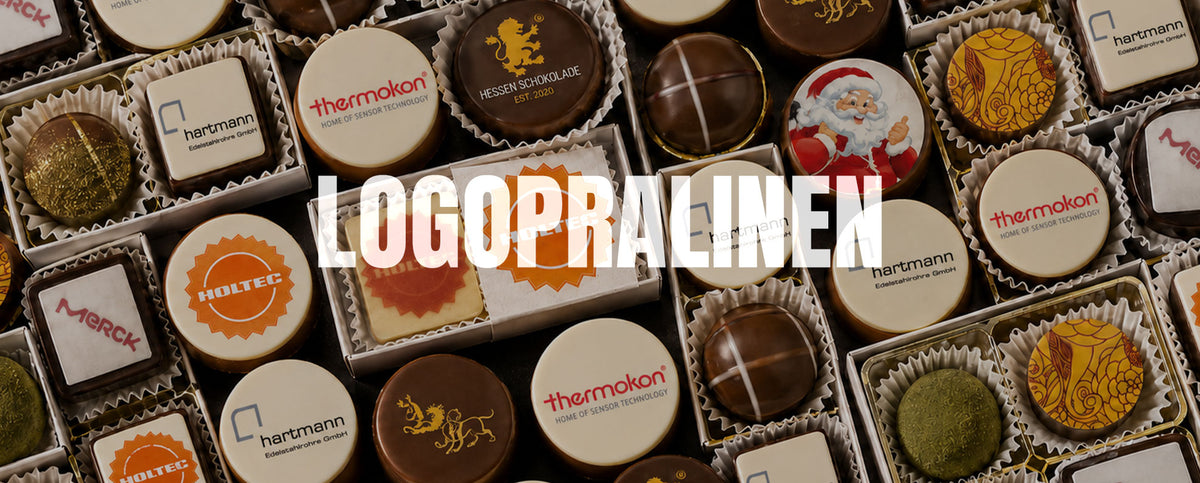 Logopralinen mit aufgedruckten Firmenlogos in Pralinenschachteln